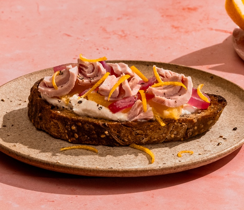 Rustic Toast with Cream Cheese, Caramelized Red Onions, Orange & Tuna